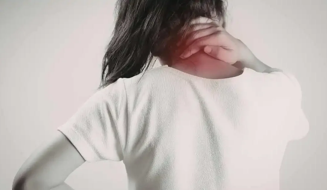 Woman experiencing neck pain related to ongoing back discomfort