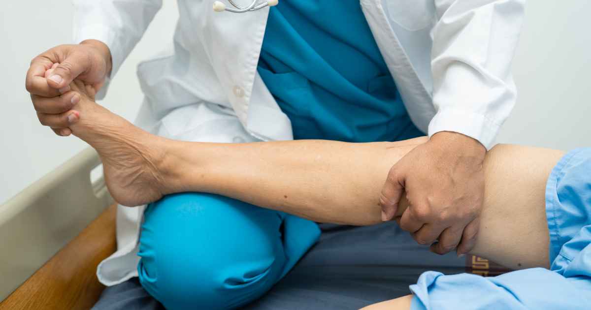 Physician helping patient after a joint injection to treat inflammation and chronic joint pain