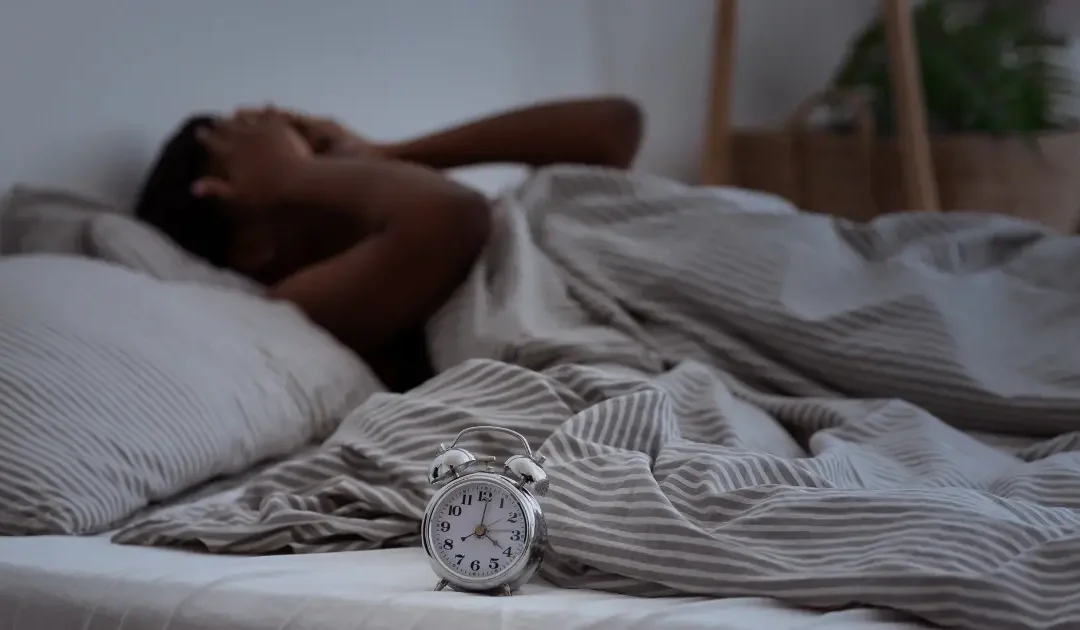 Person experiencing nerve pain at night