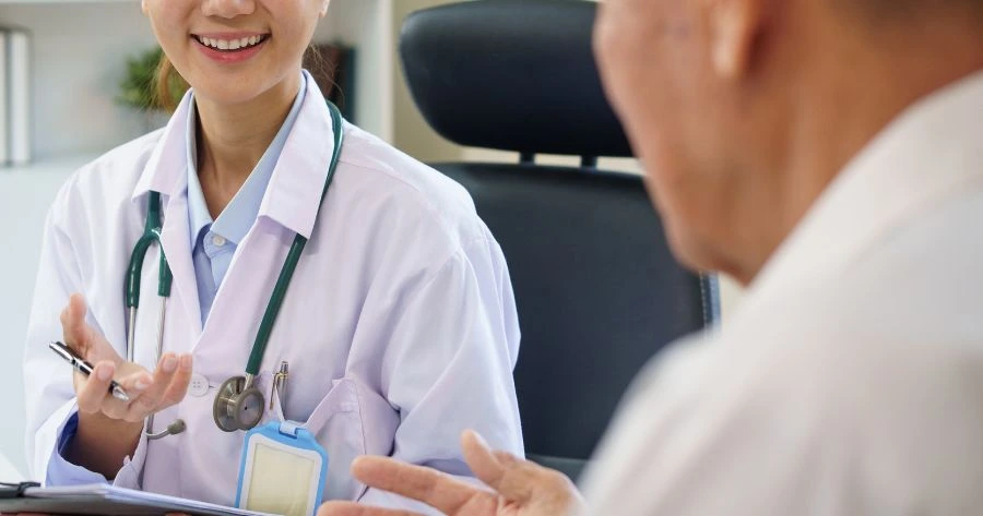 pain management specialist discussing chronic pain treatment options with patient